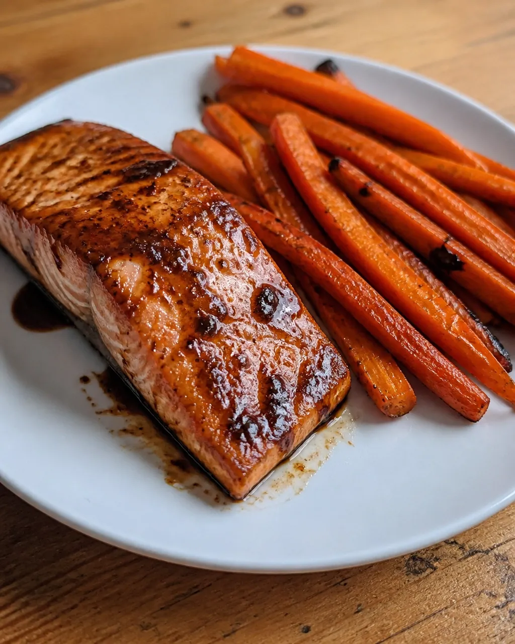 Close-up of balsamic glazed salmon with naturally caramelized roasted carrots